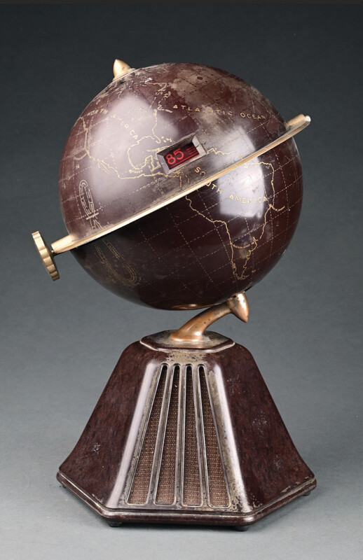 A globe-shaped radio on a pyramid base