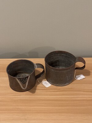 Pair of tin measuring cups