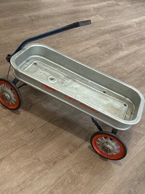 Mid-20th-century child's pull wagon stamped "GREYHOUND" on the sides