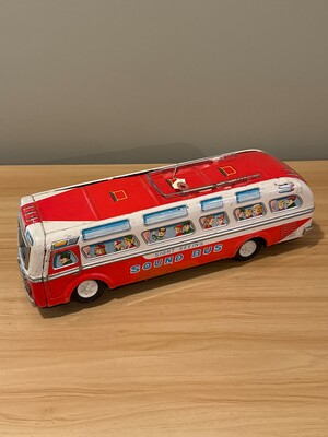 Mid-20th-century tin toy 'Sight Seeing Sound Bus' in cheerful red and