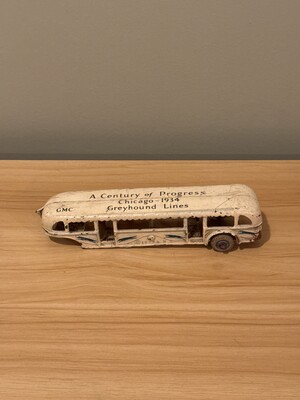 Small-scale die-cast model of a 1934 Greyhound Lines GMC bus from