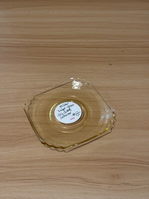 Hexagonal glass saucer with a pale yellow tint
