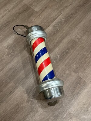 Vintage barbershop pole with the traditional red