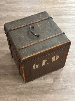 Weathered traveling trunk monogrammed 'G