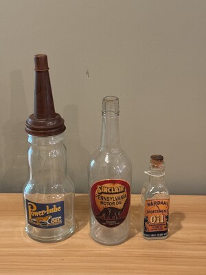 Trio of vintage motor oil bottles