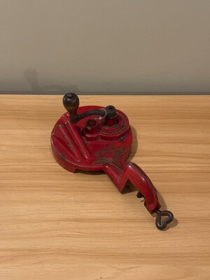 Cast-metal object painted a bold industrial red