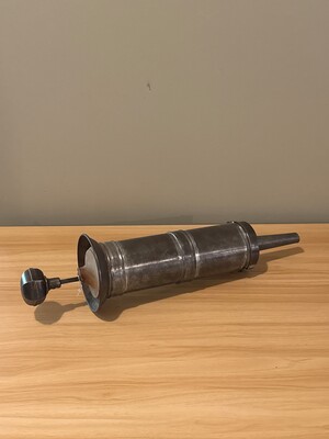 Horizontal metal tool or instrument of unknown purpose