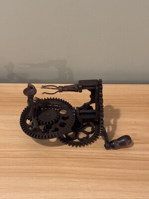 Mechanical assemblage of interlocking gears and cogs