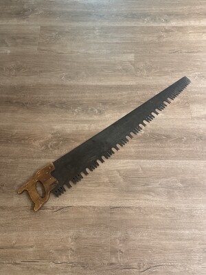Old hand saw with a darkened