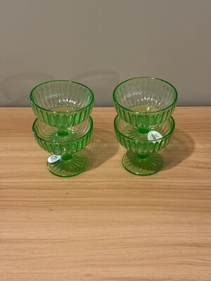 Set of four ribbed green glass cups