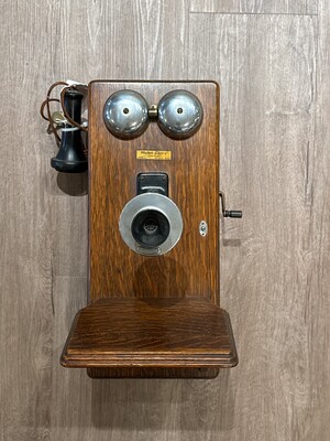 Western Electric wall telephone with a robust wooden body and softly