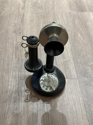 Vintage candlestick telephone in black with metallic accents