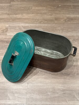 Metal basin with a brightly colored hinged lid