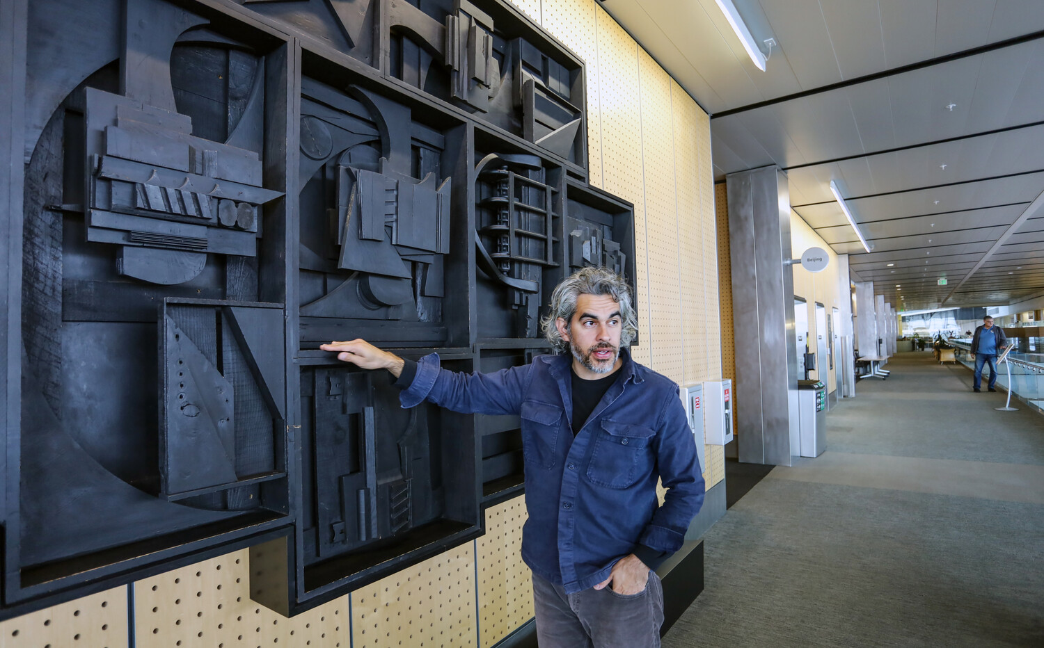 Tommy Gregory with Louise Nevelson’s *Night Flight #1* PHOTO BY KELLY O
