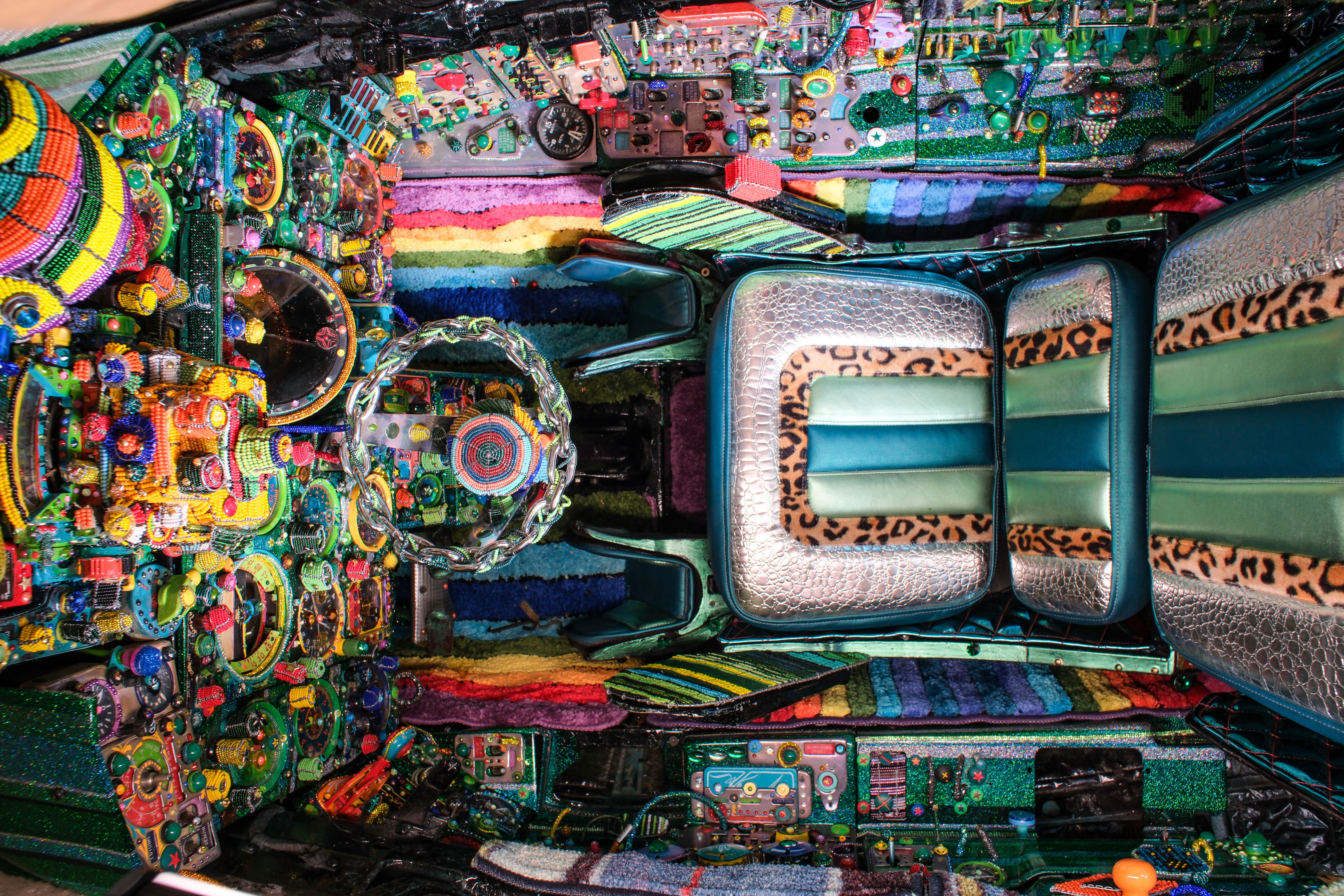 The embellished cockpit showing the old school lowrider style upholstered seat. Photo by Paul Duran-Lemos.