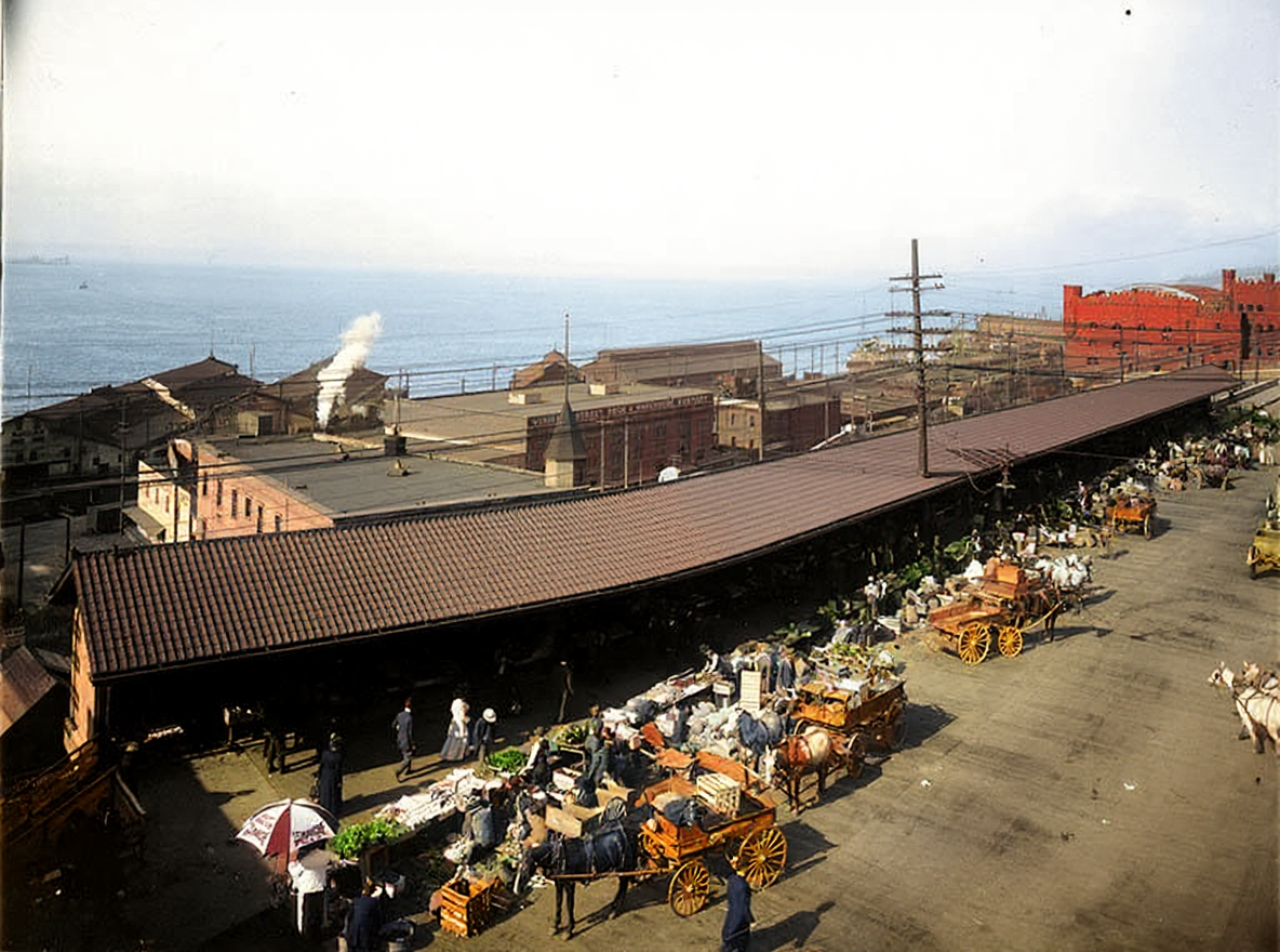 Pike Place Market arcade and farmers' wagons, c. 1910